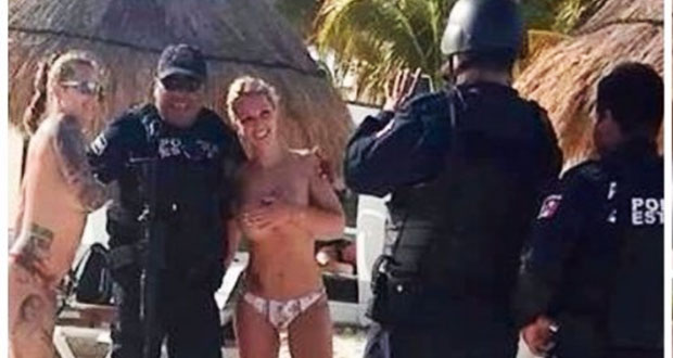 Sancionan a 3 policías por fotos con turistas “topless” en Cancún