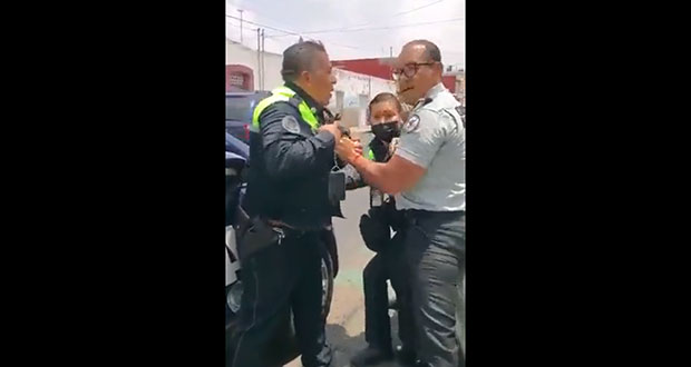 Presunto agente que riñe con municipales de Puebla no es activo: GN